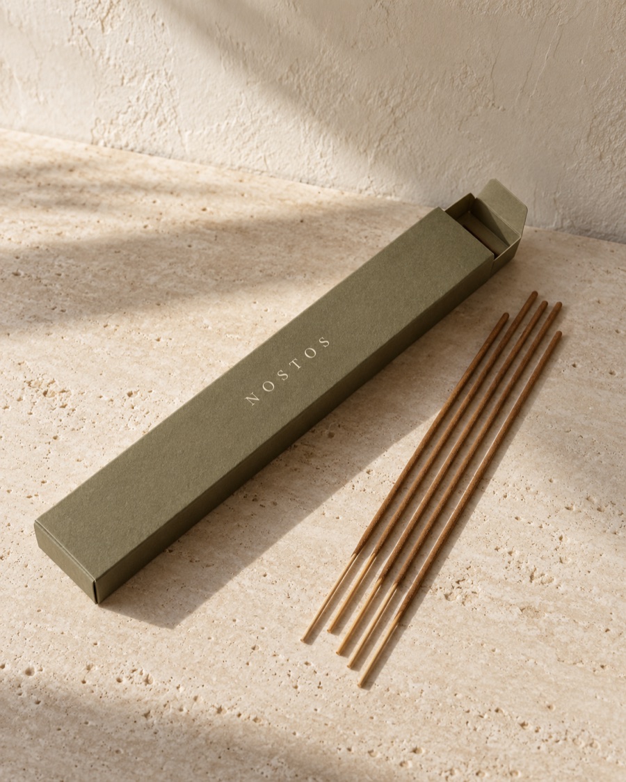 NOSTOS concept incense, photographed on warm limestone.