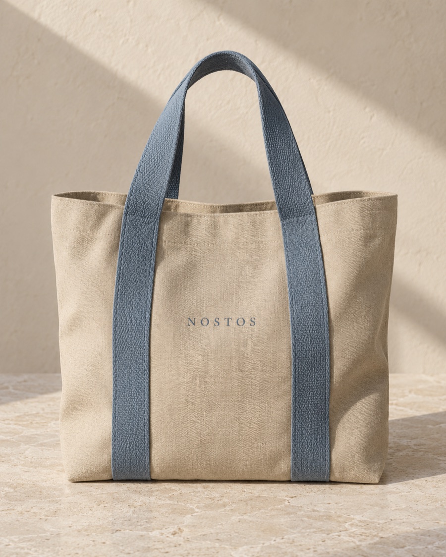 NOSTOS concept everyday tote in sand, photographed on warm limestone.